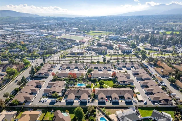 an aerial view of residential houses with outdoor space