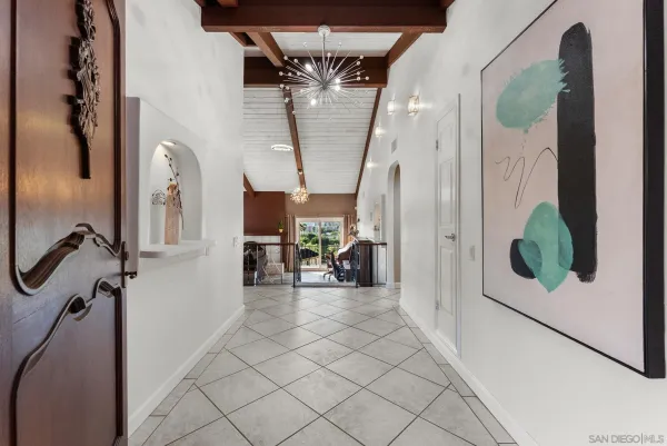 a view of a hallway with a dining area