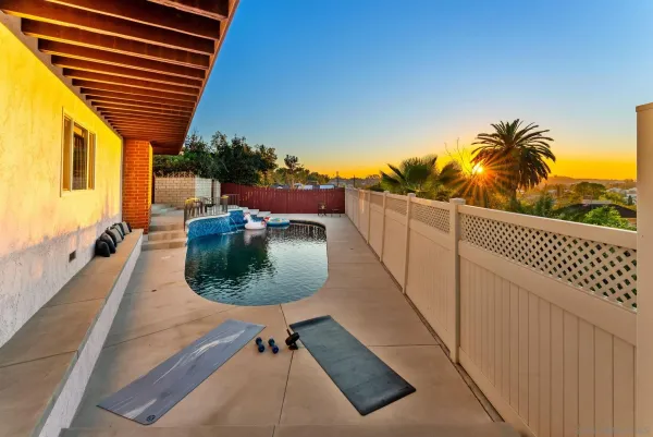 a view of balcony with furniture