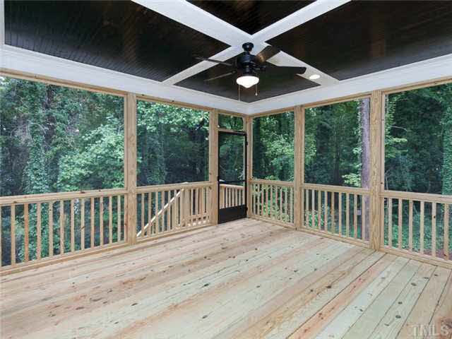 2104 East Charlotte Court Raleigh, NC 27607 - Photo 21 of 23 This .41 acre lot is heavily wooded. The views from the screen in porch. Follow the steps down to the grilling concrete patio grilling area...