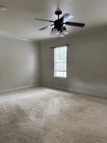 a view of an empty room and a window