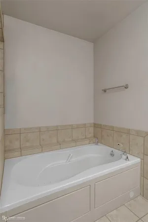 a bathroom with a bathtub and shower