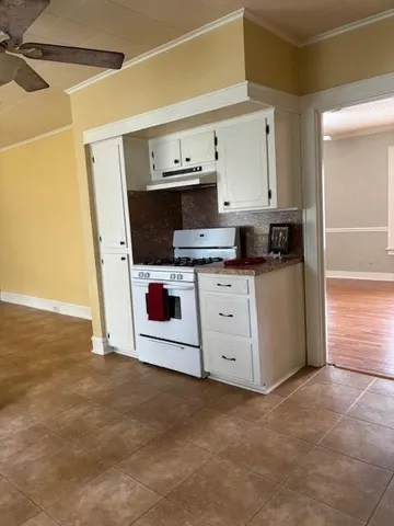 a kitchen with stainless steel appliances a stove a sink and a refrigerator