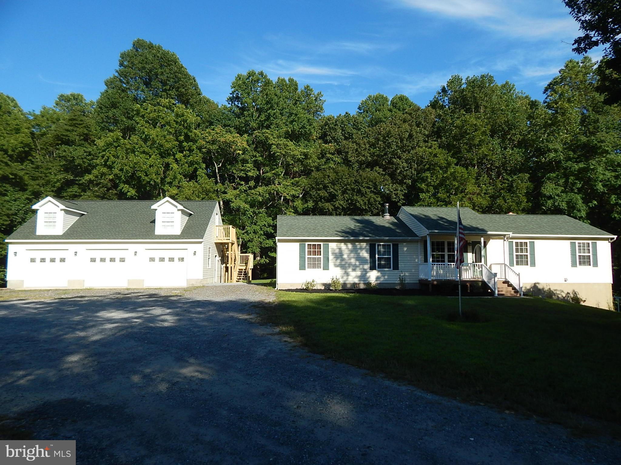 1615 Lottie Fowler Road Prince Frederick, MD 20678 - Photo 2 of 29 a front view of a house with a garden