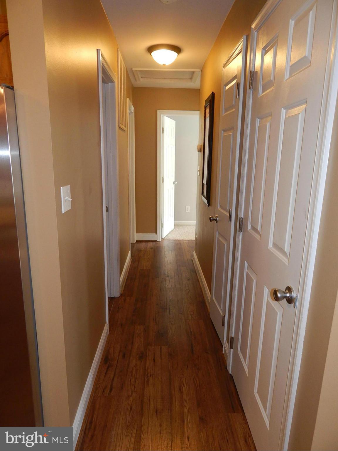 1615 Lottie Fowler Road Prince Frederick, MD 20678 - Photo 14 of 29 a view of a hallway with wooden floor