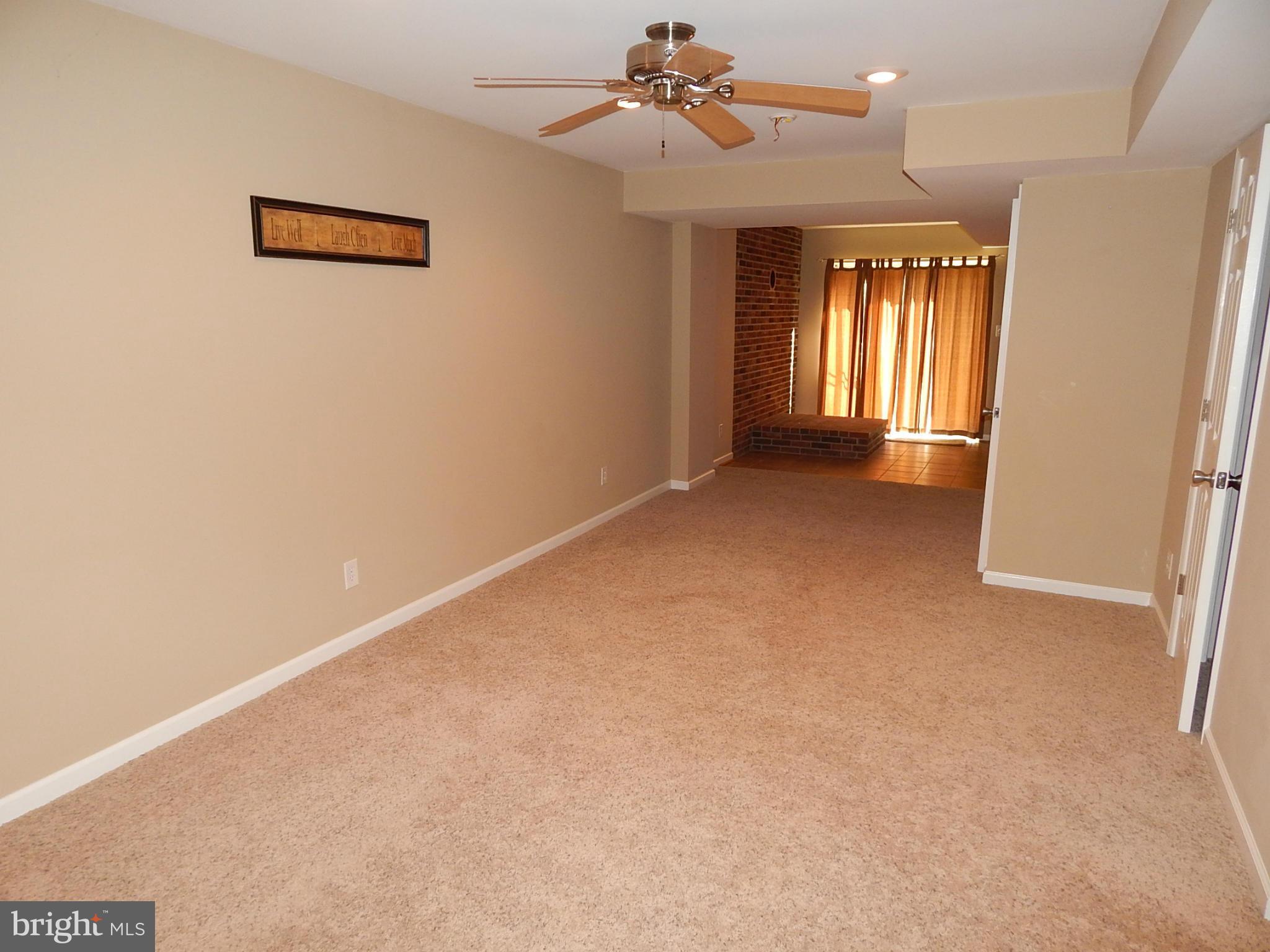 1615 Lottie Fowler Road Prince Frederick, MD 20678 - Photo 16 of 29 an empty room with windows and fan