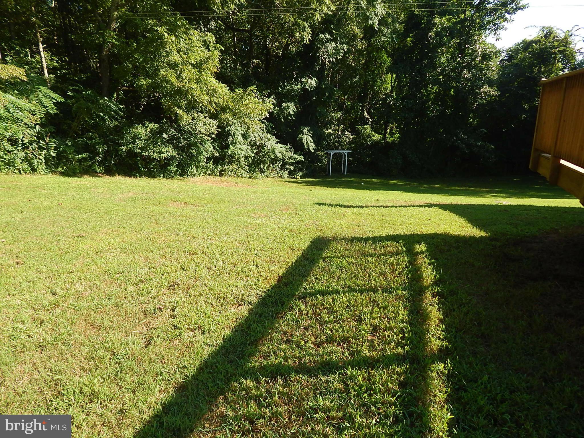 1615 Lottie Fowler Road Prince Frederick, MD 20678 - Photo 22 of 29 a view of yard with swimming pool and green space