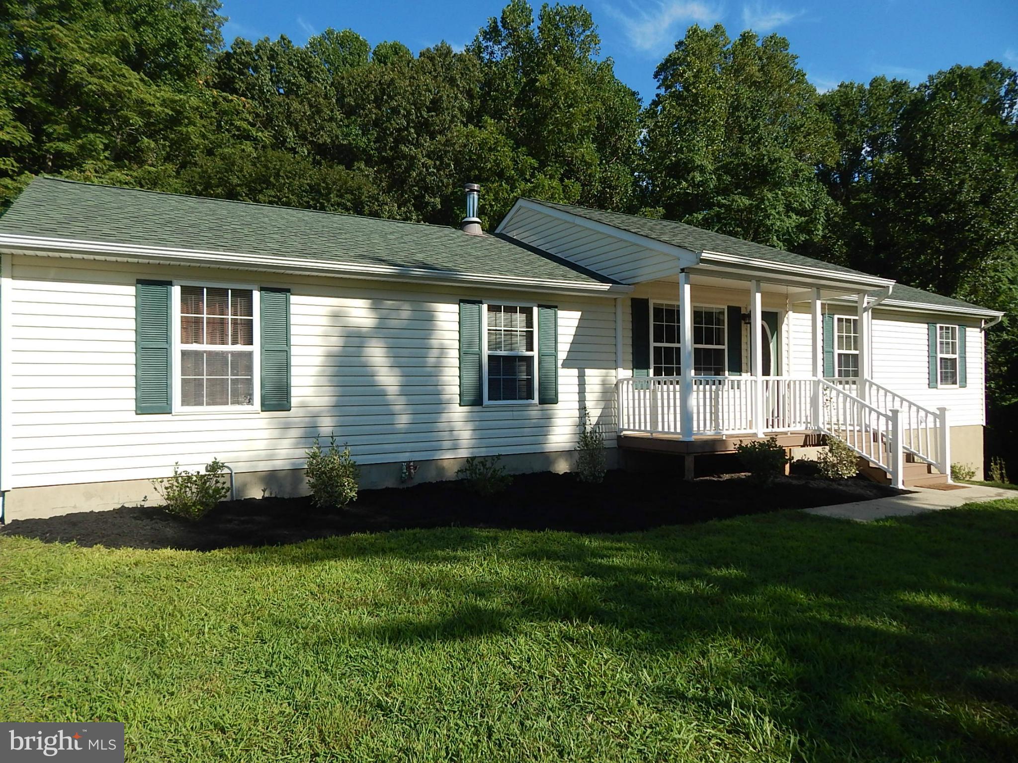 1615 Lottie Fowler Road Prince Frederick, MD 20678 - Photo 26 of 29 a front view of a house with a yard
