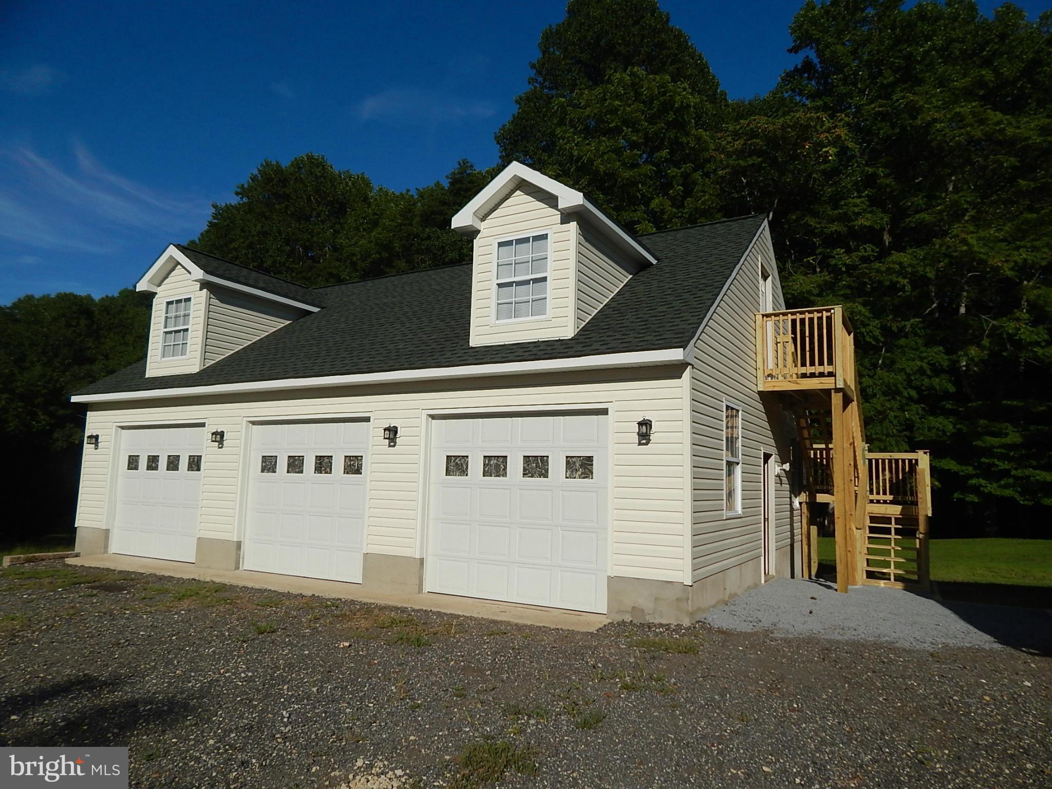 1615 Lottie Fowler Road Prince Frederick, MD 20678 - Photo 27 of 29 a front view of a house with a yard