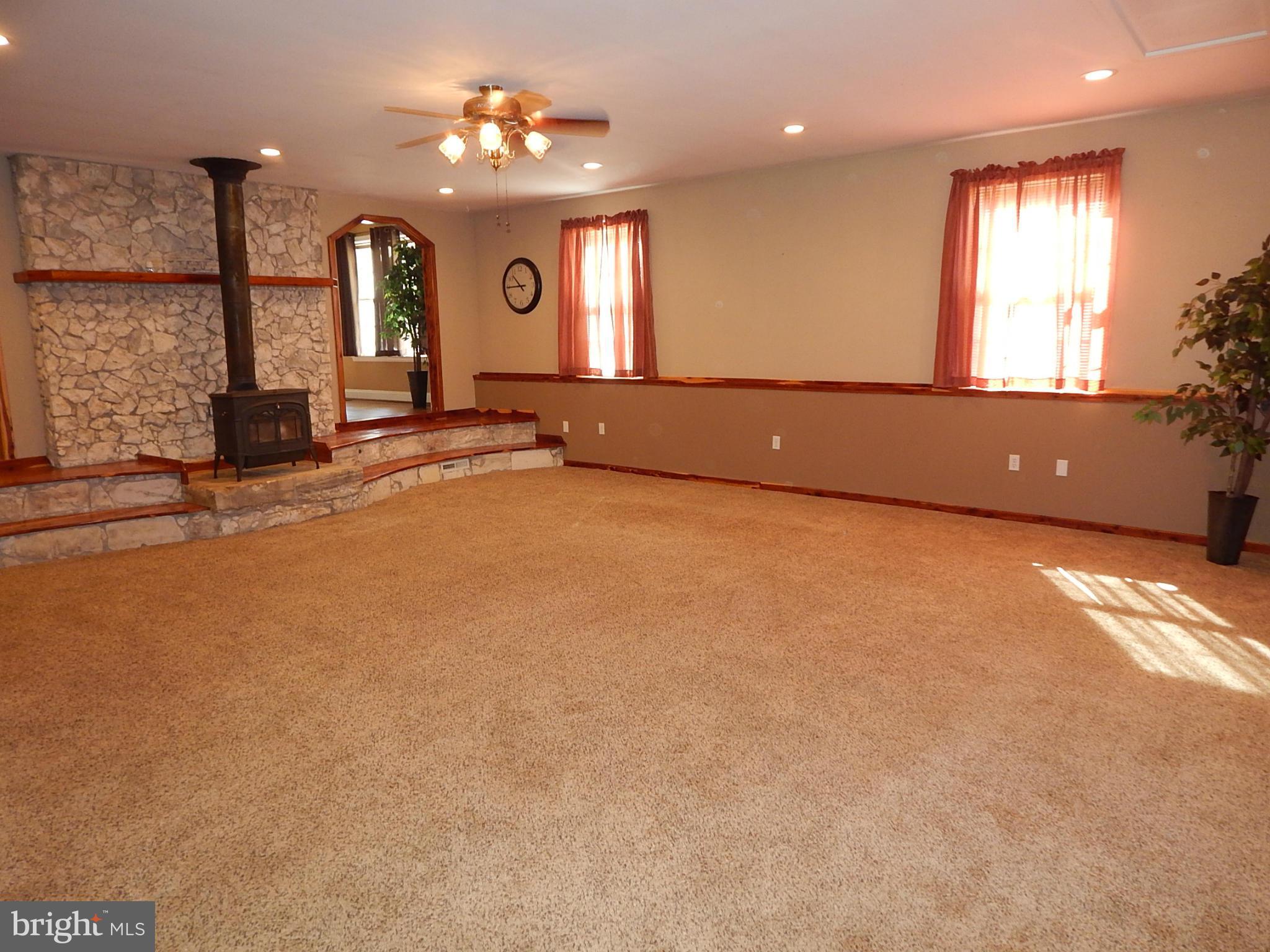 1615 Lottie Fowler Road Prince Frederick, MD 20678 - Photo 10 of 29 an empty room with windows and ceiling fan