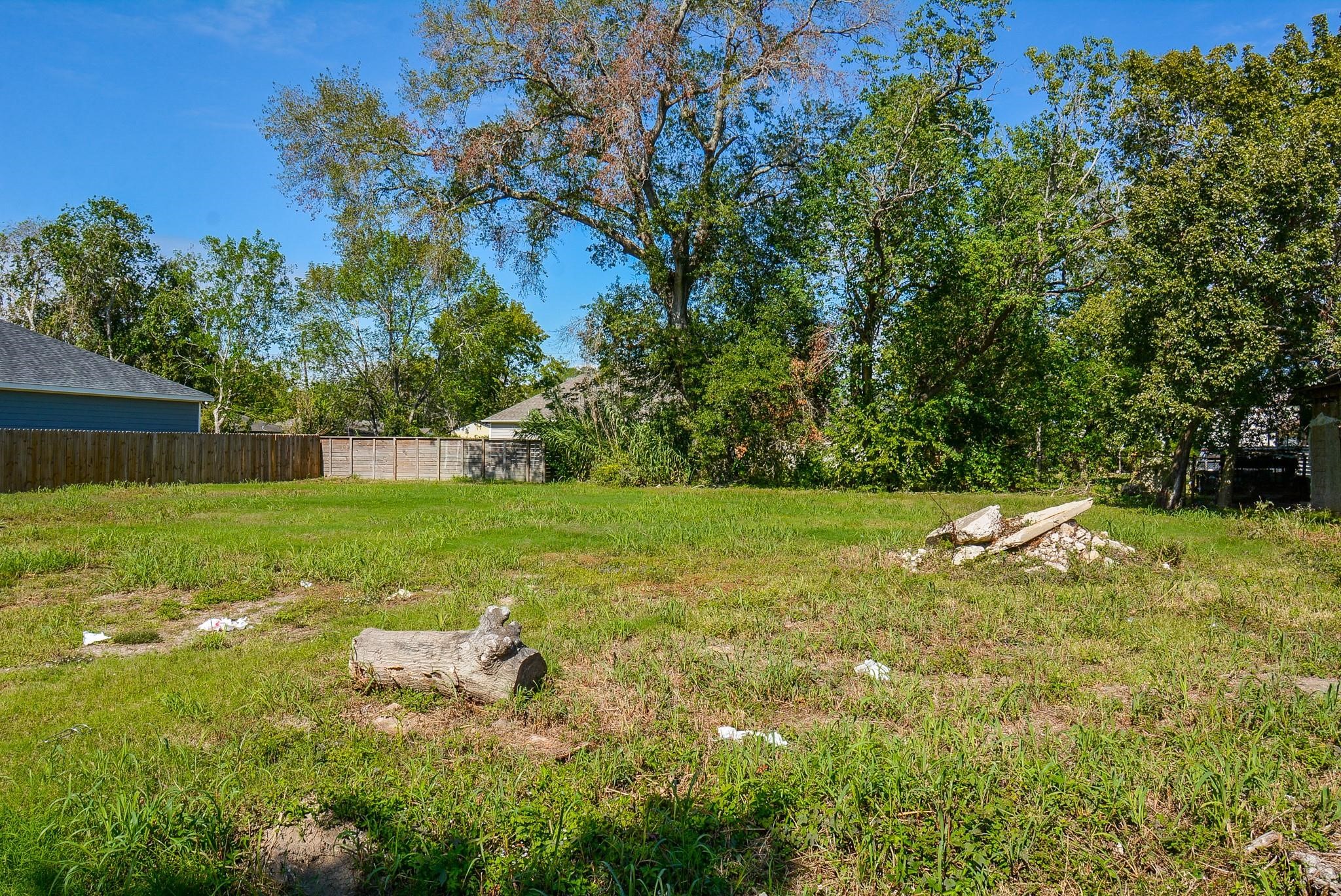 4607 Larkspur Street Houston, TX 77051 - Photo 8 of 18 a view of a garden with a bench