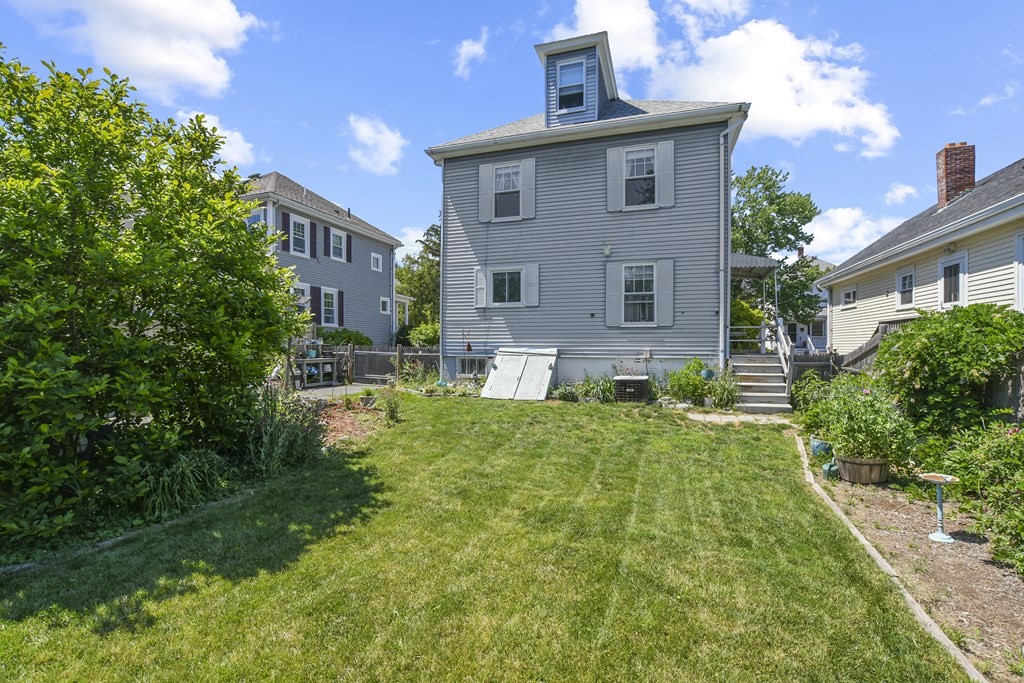 17 Trask Street Danvers, MA 01923 - Photo 28 of 29 a front view of a house with garden