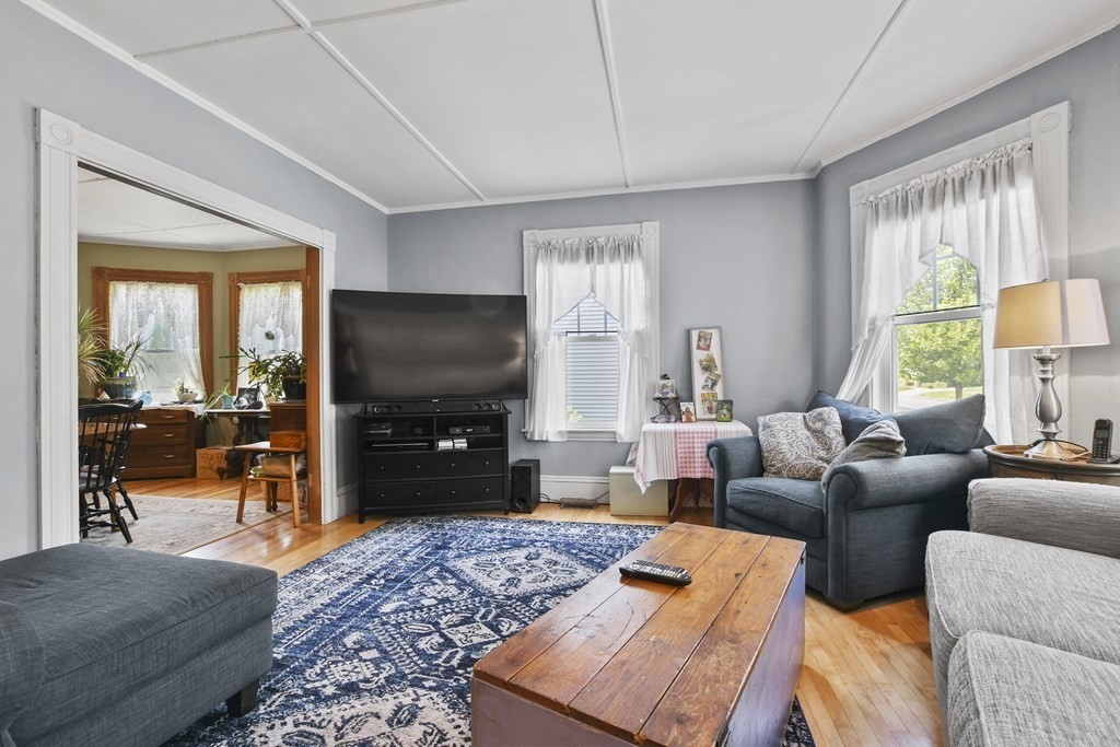 17 Trask Street Danvers, MA 01923 - Photo 4 of 29 a living room with furniture and a flat screen tv