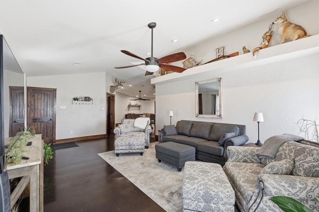 1748 Wilson Road Palmer, TX 75152 - Photo 8 of 40 a living room with furniture and a wooden floor