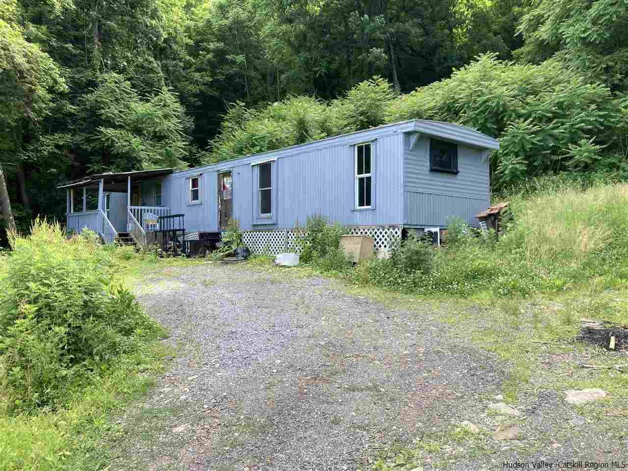 10 Edward Road Milton, NY 12547 - Photo 1 of 16 a backyard of a house with lots of green space
