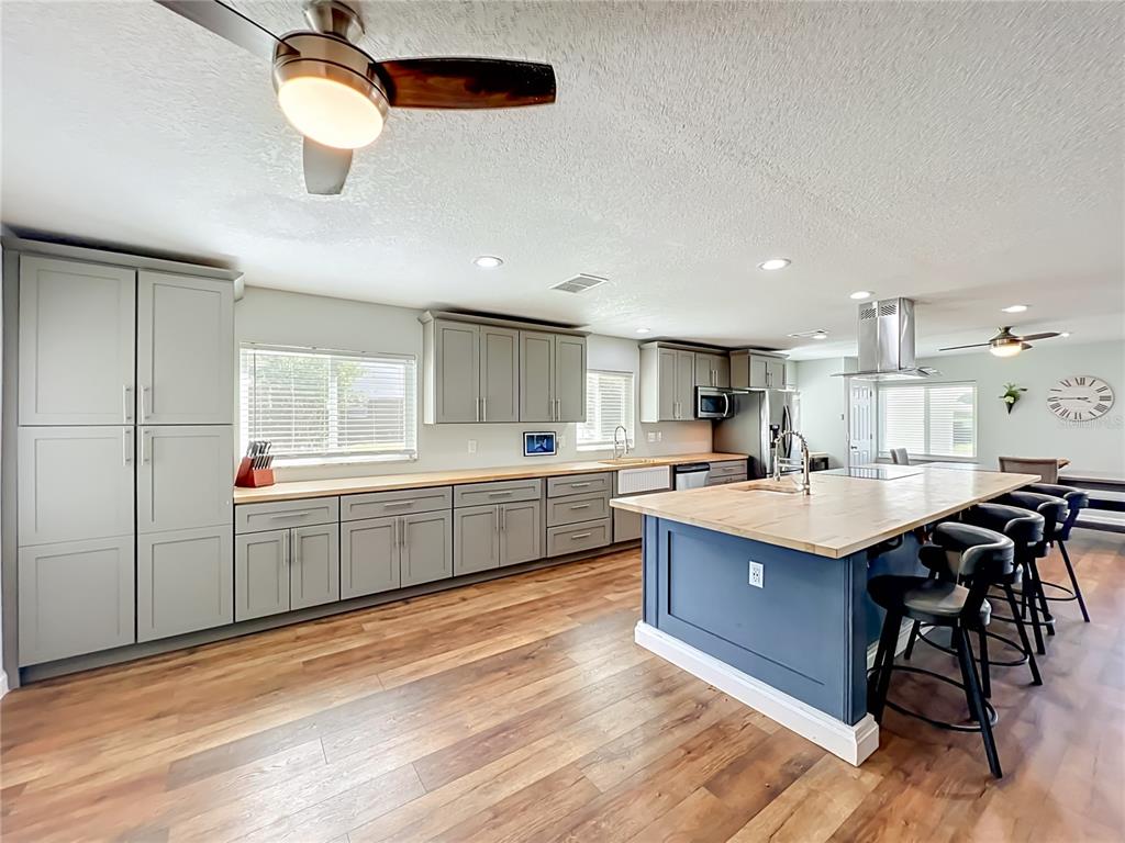 153 Variety Tree Circle Altamonte Springs, FL 32714 - Photo 14 of 44 a kitchen with cabinets and window