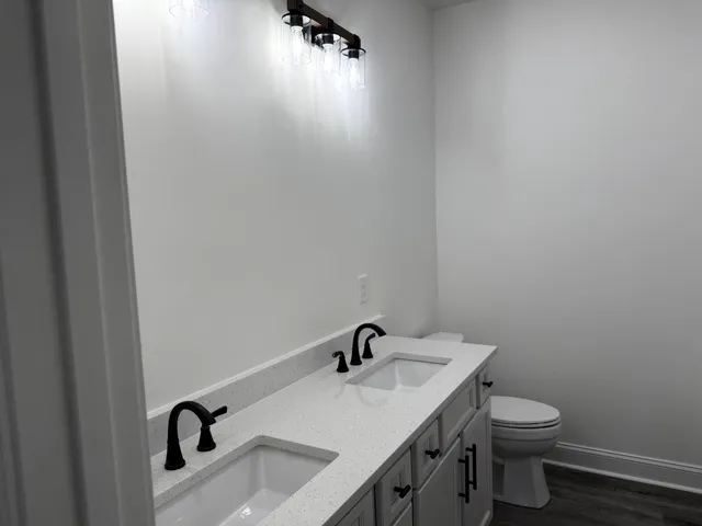 a bathroom with a sink and mirror