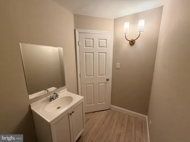 a bathroom with a sink and mirror
