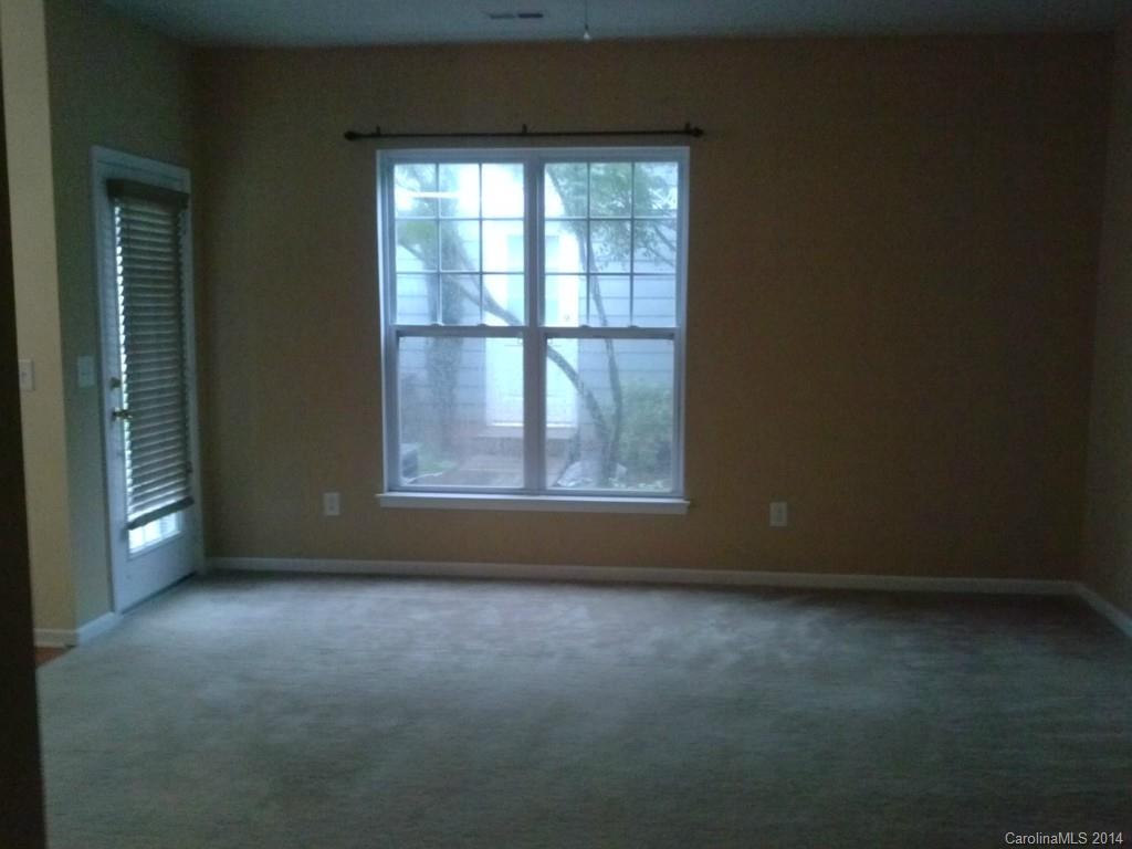 219 Faust Road Davidson, NC 28036 - Photo 3 of 12 an empty room with a empty space and windows