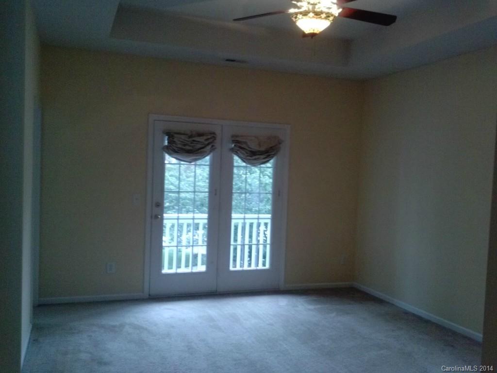 219 Faust Road Davidson, NC 28036 - Photo 6 of 12 a view of an empty room with a window