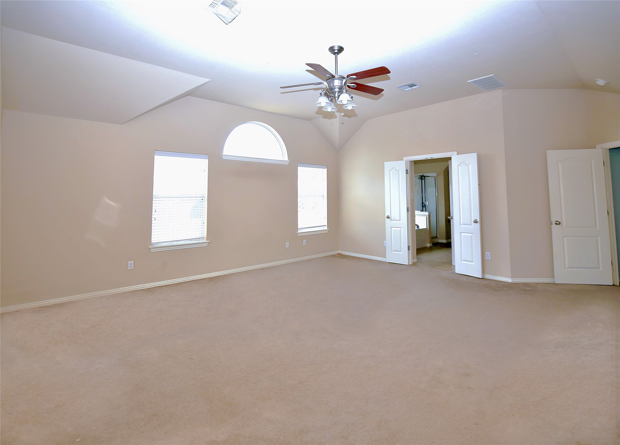2002 Singing Hills Leander, TX 78641 - Photo 15 of 31 an empty room with chandelier fan and windows