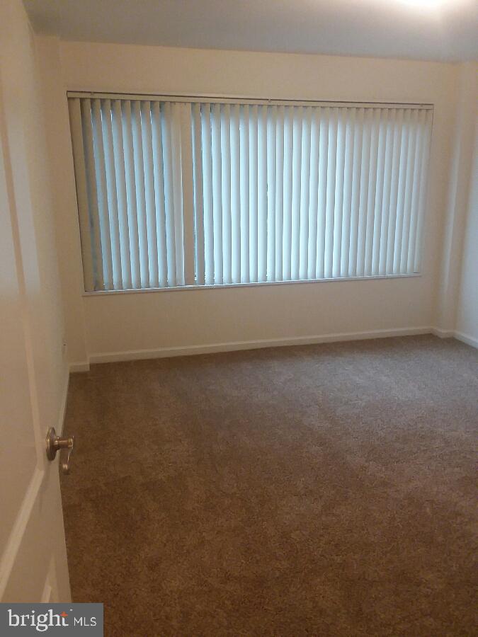 10570 Main Street, Unit 524 Fairfax, VA 22030 - Photo 12 of 19 an empty room with a window
