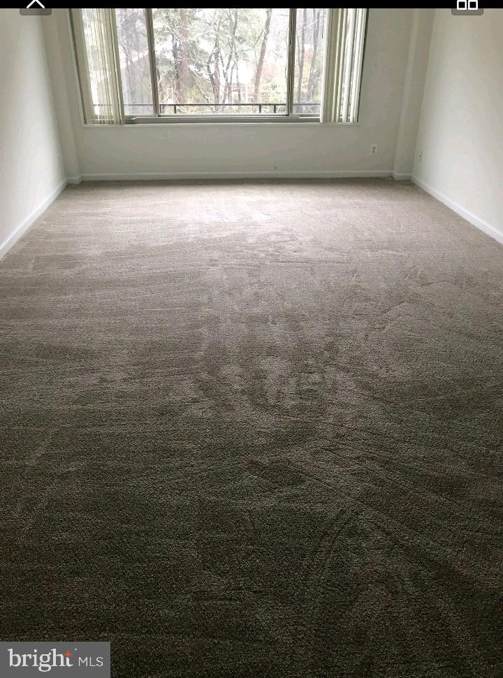 10570 Main Street, Unit 524 Fairfax, VA 22030 - Photo 18 of 19 a view of an empty room and window