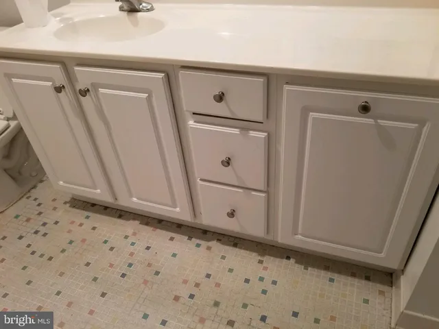 a view of a storage & utility room with a sink