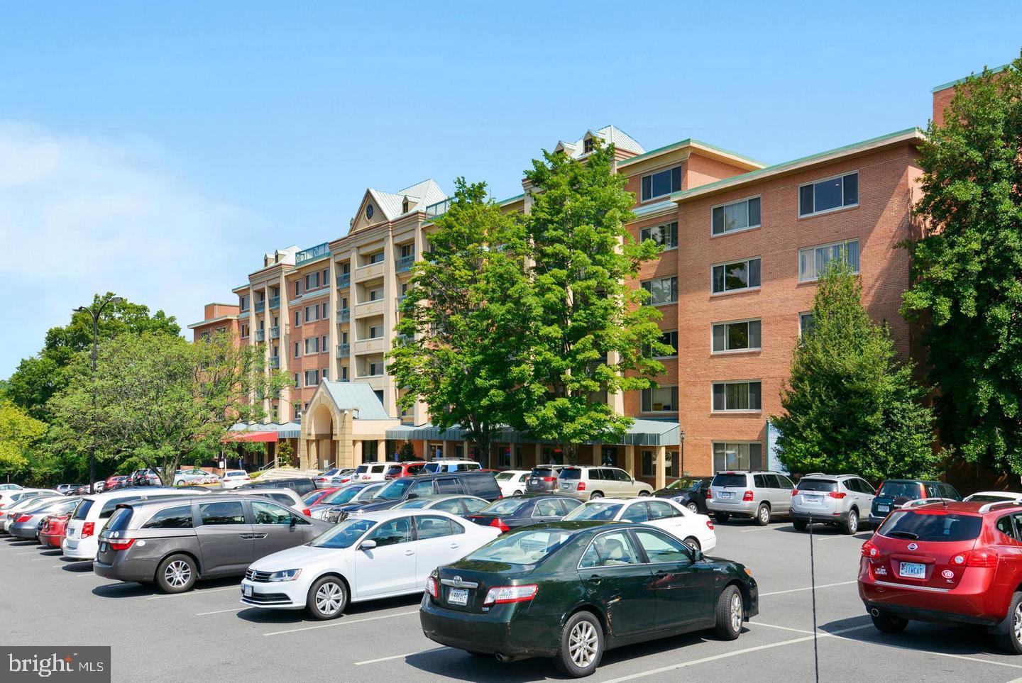 10570 Main Street, Unit 524 Fairfax, VA 22030 - Photo 2 of 19 a cars parked in front of a building
