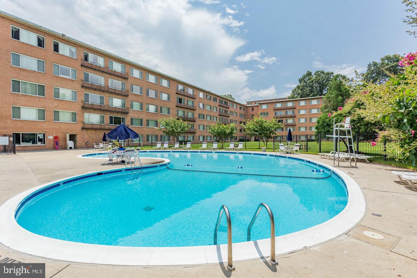 10570 Main Street, Unit 524 Fairfax, VA 22030 - Photo 3 of 19 a view of a swimming pool with outdoor seating