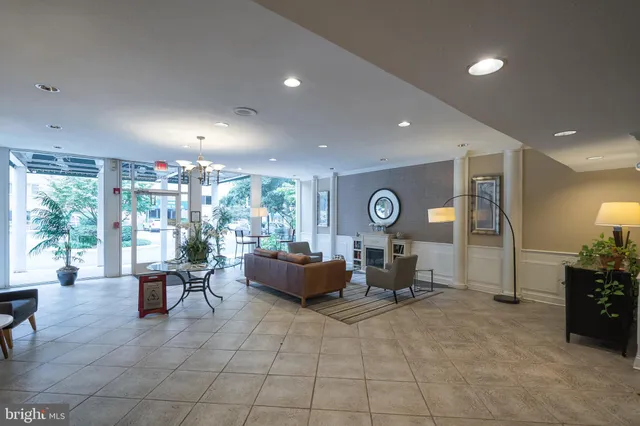 a living room with furniture window and outdoor view