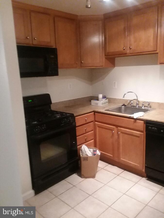 10570 Main Street, Unit 524 Fairfax, VA 22030 - Photo 9 of 19 a kitchen with a sink and a stove