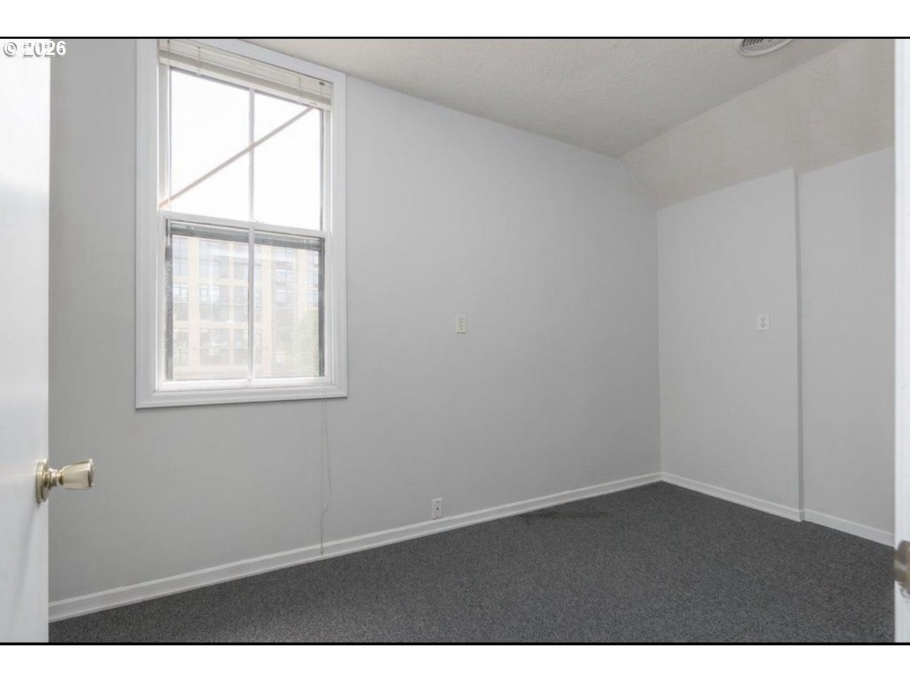 1326 Southwest 12th Avenue Portland, OR 97201 - Photo 6 of 11 an empty room with a window