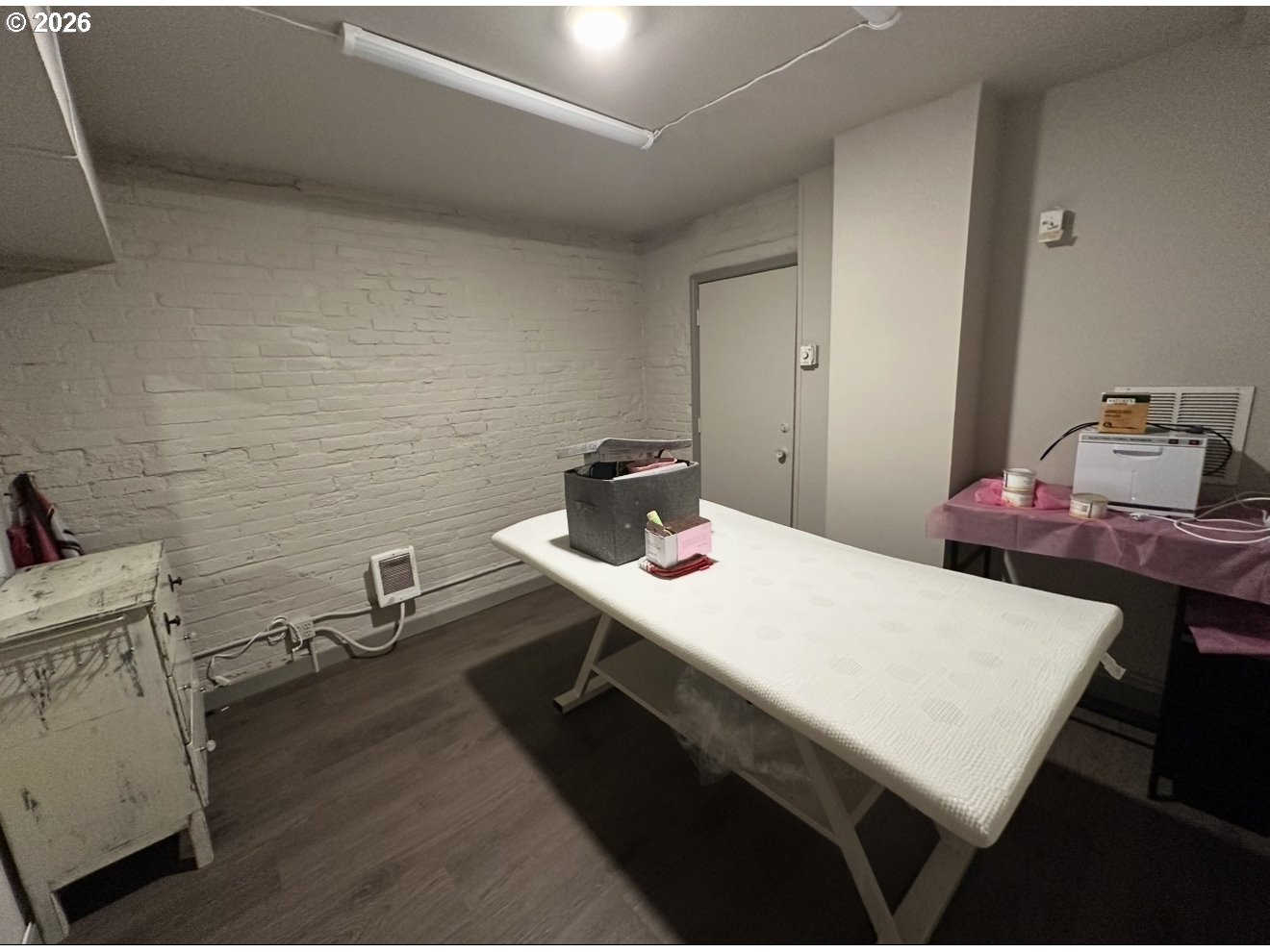 1326 Southwest 12th Avenue Portland, OR 97201 - Photo 10 of 11 a room with a table chairs and wooden floor
