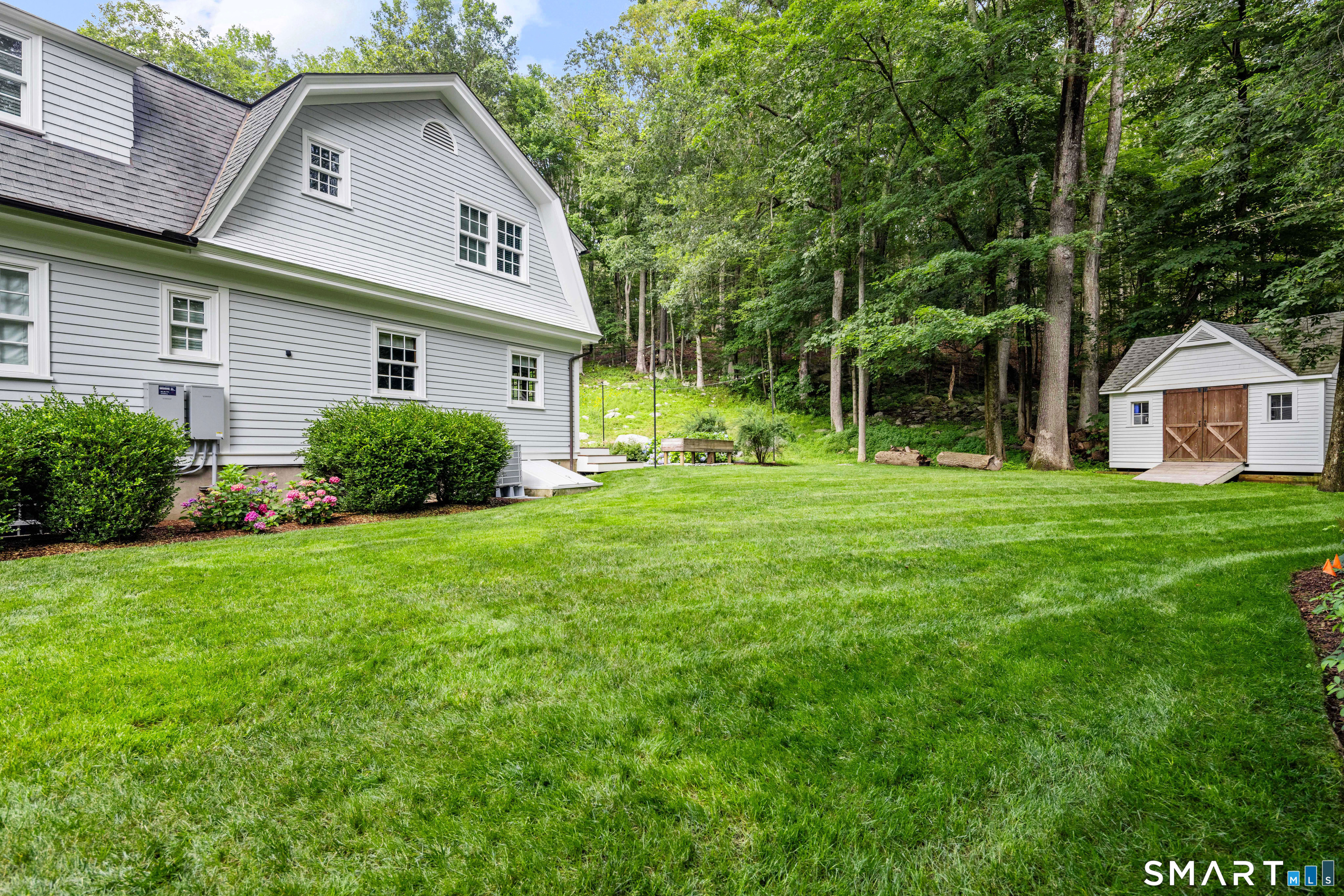 99 Hickok Road New Canaan, CT 06840 - Photo 35 of 39 a view of a yard in front of house