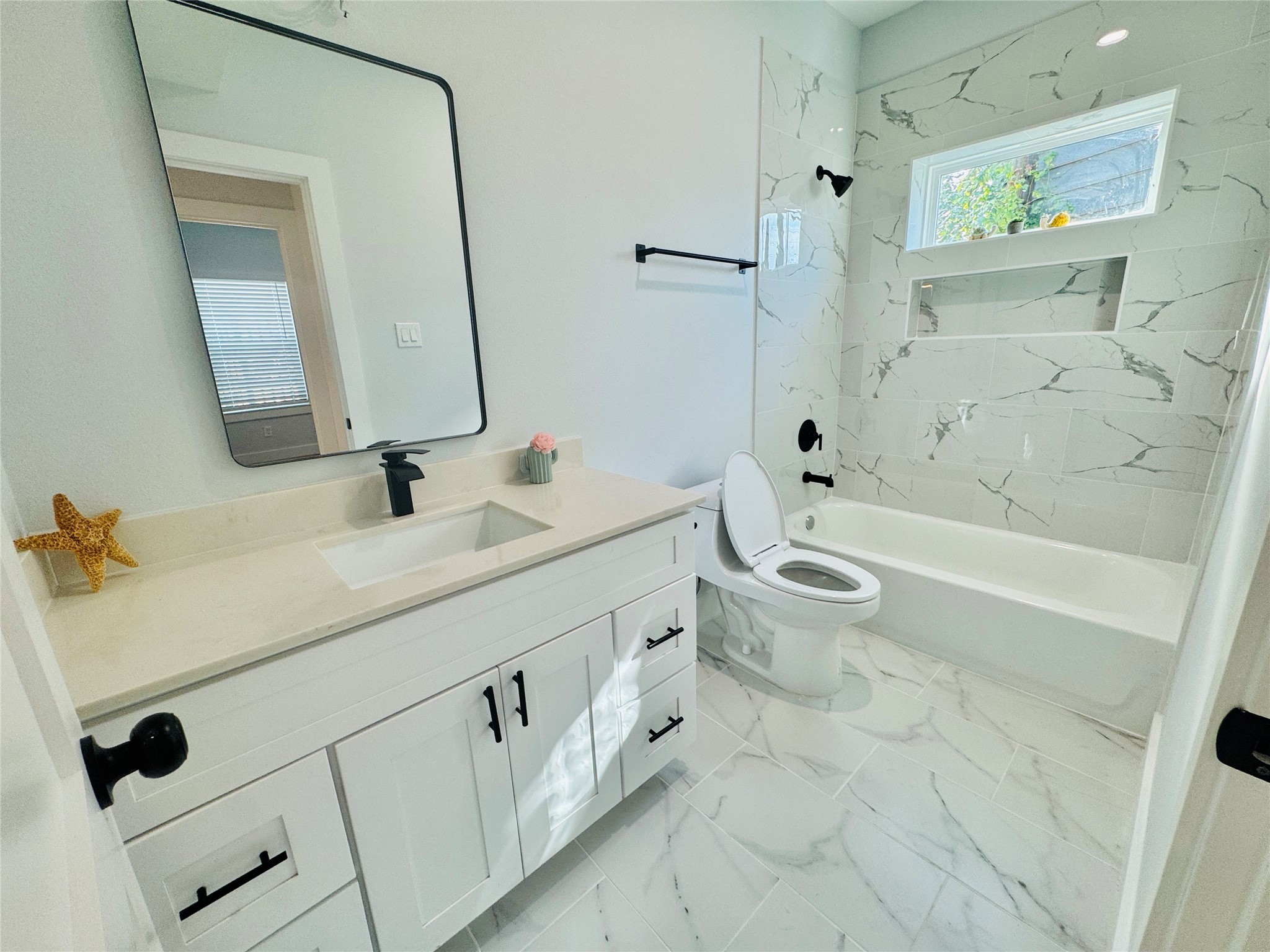9362 Starfire Lane Houston, TX 77036 - Photo 5 of 11 a bathroom with a double vanity sink mirror and toilet