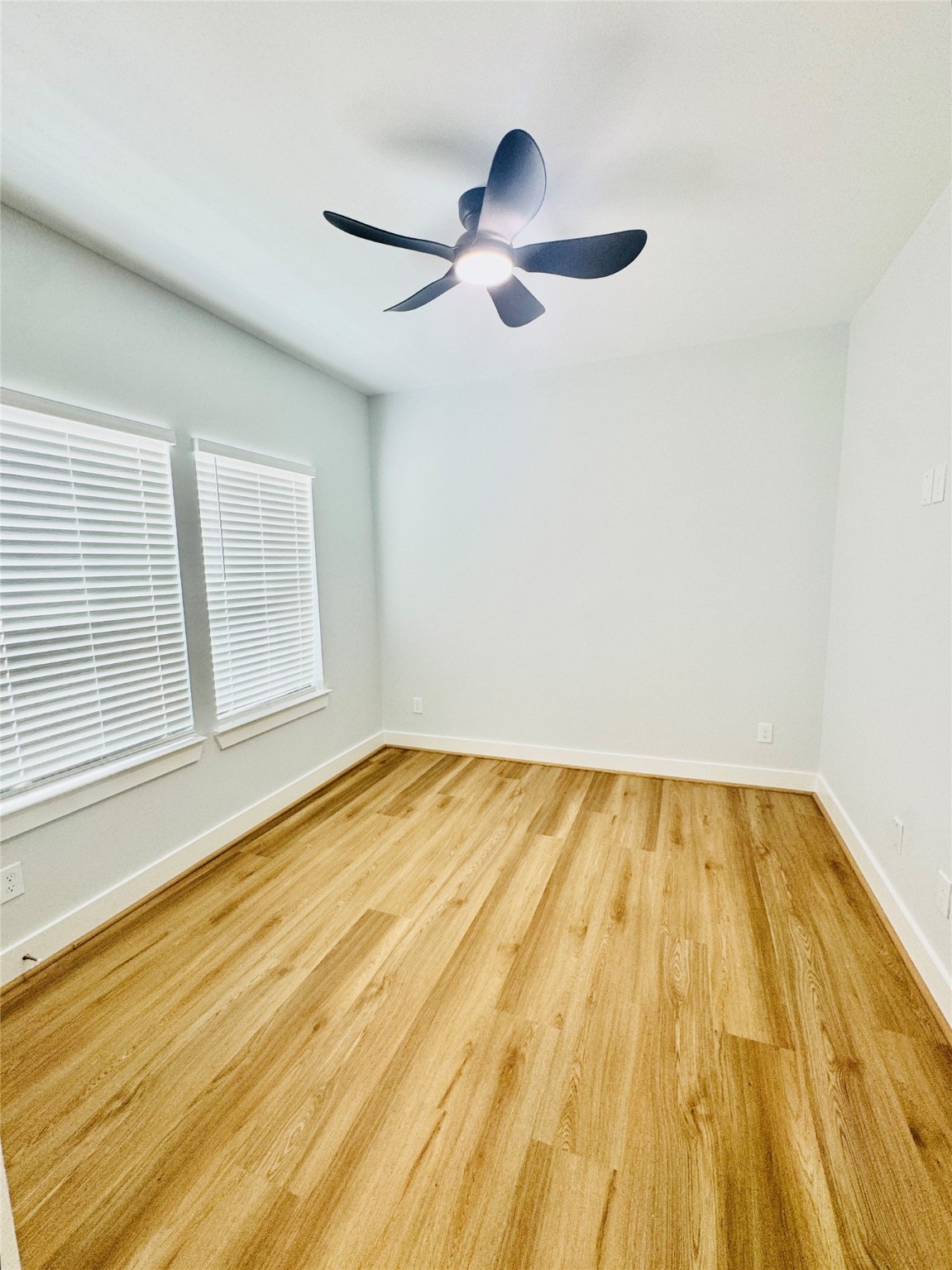 9362 Starfire Lane Houston, TX 77036 - Photo 10 of 11 a view of empty room with wooden floor