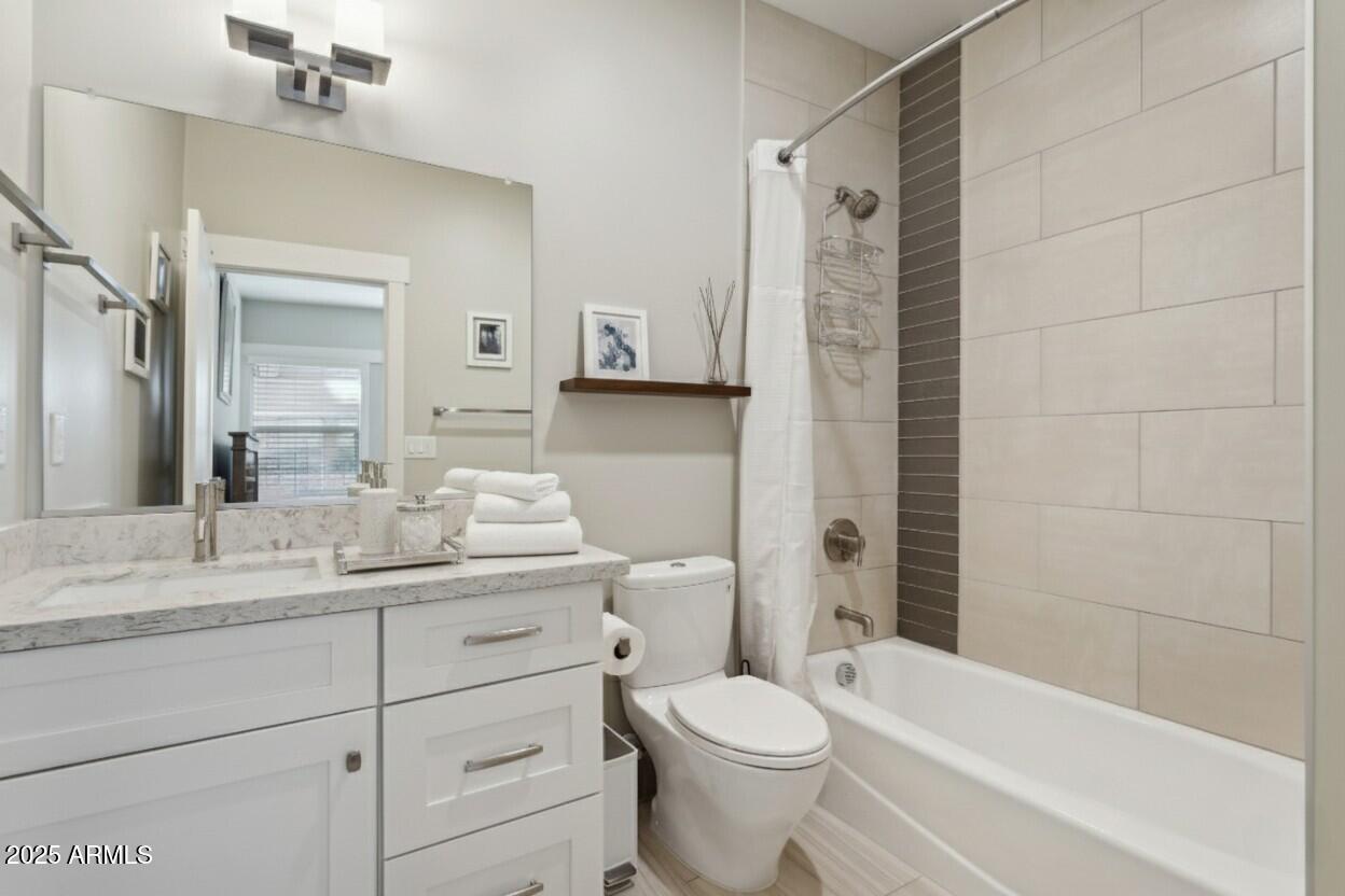 1400 East Bethany Home Road, Unit 22 Phoenix, AZ 85014 - Photo 7 of 46 a bathroom with a double vanity sink toilet and shower