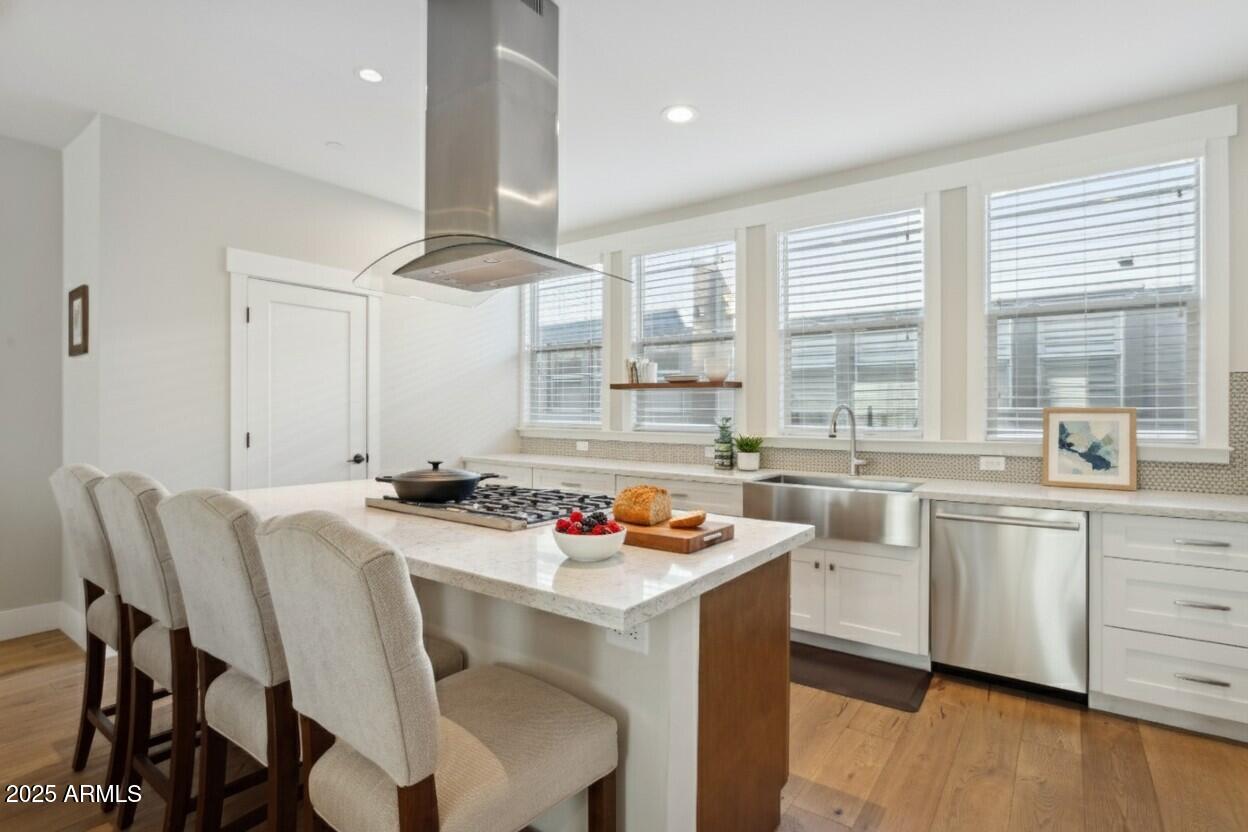 1400 East Bethany Home Road, Unit 22 Phoenix, AZ 85014 - Photo 11 of 46 a kitchen that has a cabinets counter space and a table in it