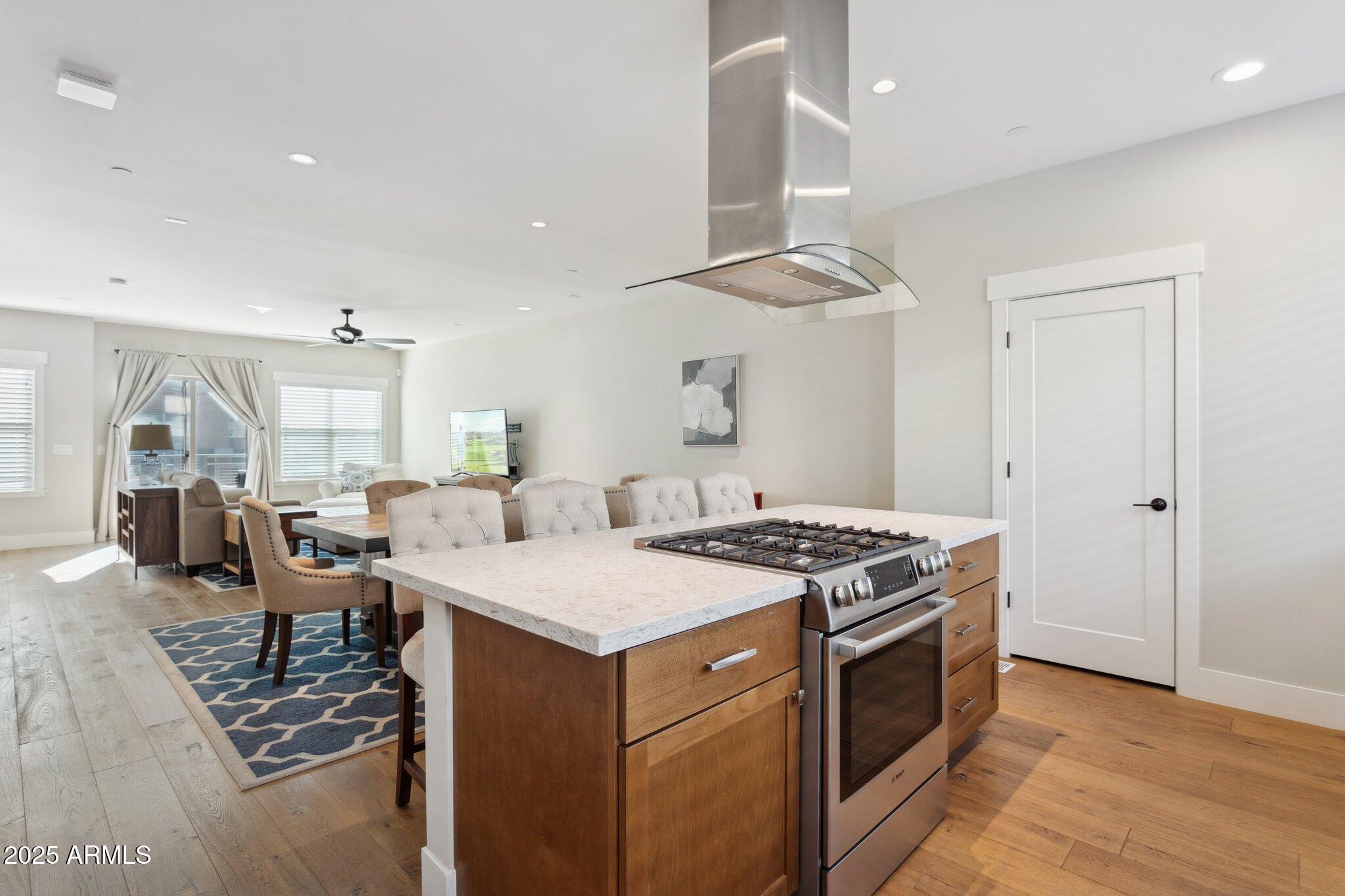 1400 East Bethany Home Road, Unit 22 Phoenix, AZ 85014 - Photo 13 of 46 a kitchen that has a stove a table and chairs in it