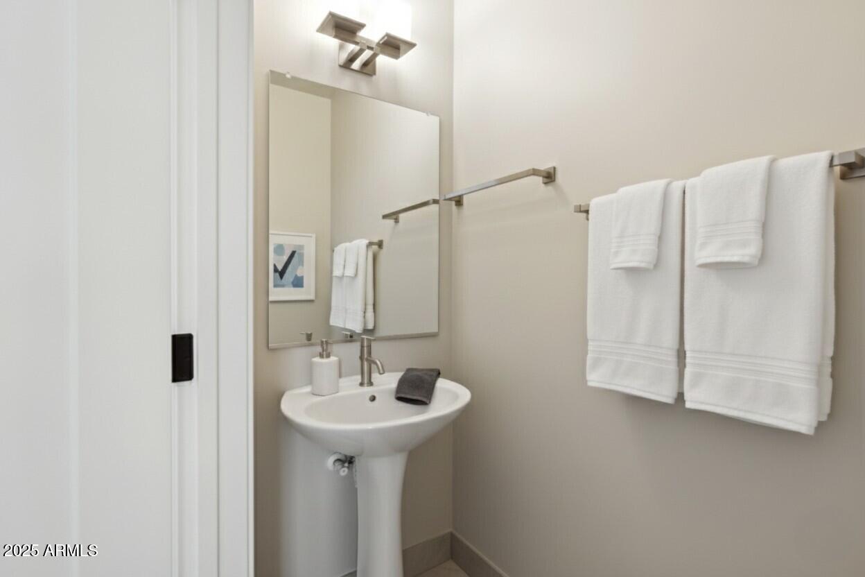 1400 East Bethany Home Road, Unit 22 Phoenix, AZ 85014 - Photo 18 of 46 a bathroom with a sink and mirror