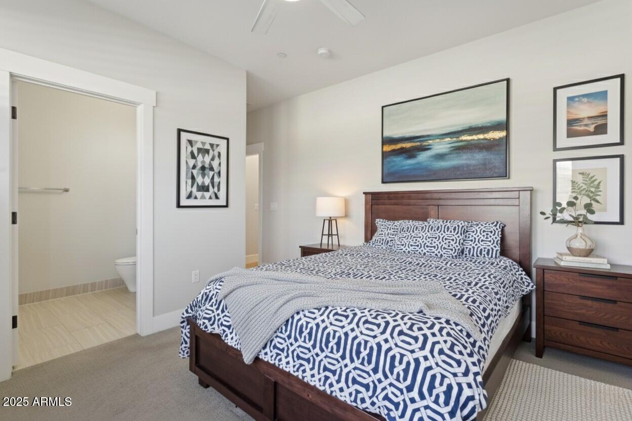 1400 East Bethany Home Road, Unit 22 Phoenix, AZ 85014 - Photo 20 of 46 a bedroom with a bed and a painting on the wall