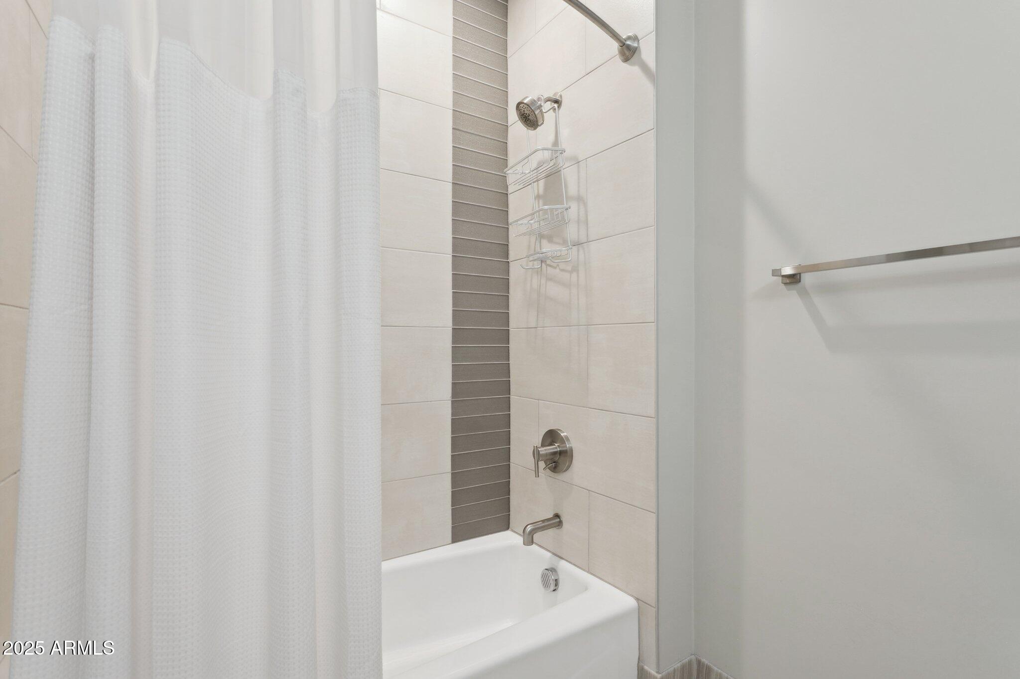 1400 East Bethany Home Road, Unit 22 Phoenix, AZ 85014 - Photo 23 of 46 a bathroom with a sink a toilet and shower