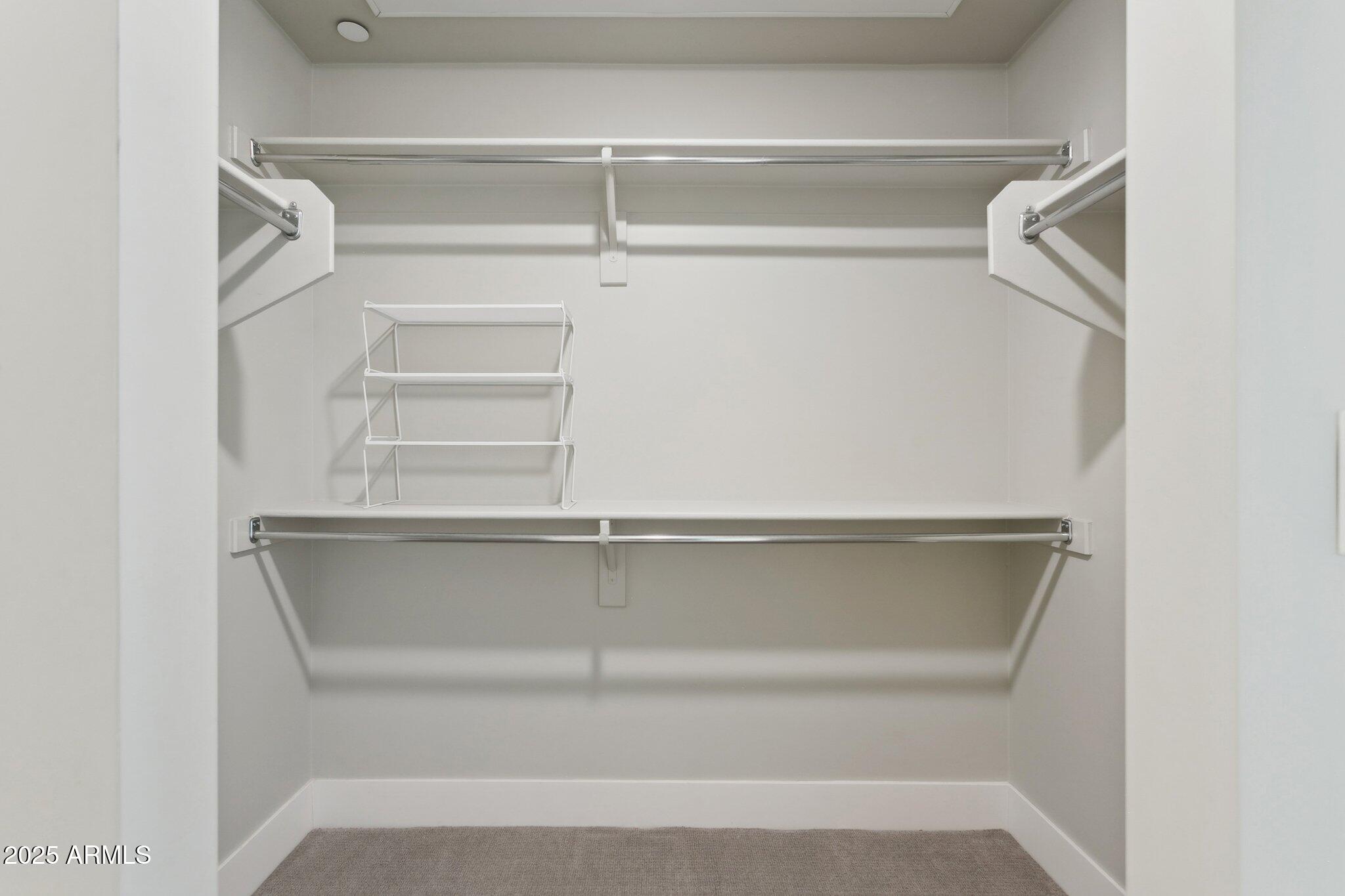 1400 East Bethany Home Road, Unit 22 Phoenix, AZ 85014 - Photo 28 of 46 a view of walk in closet with empty racks