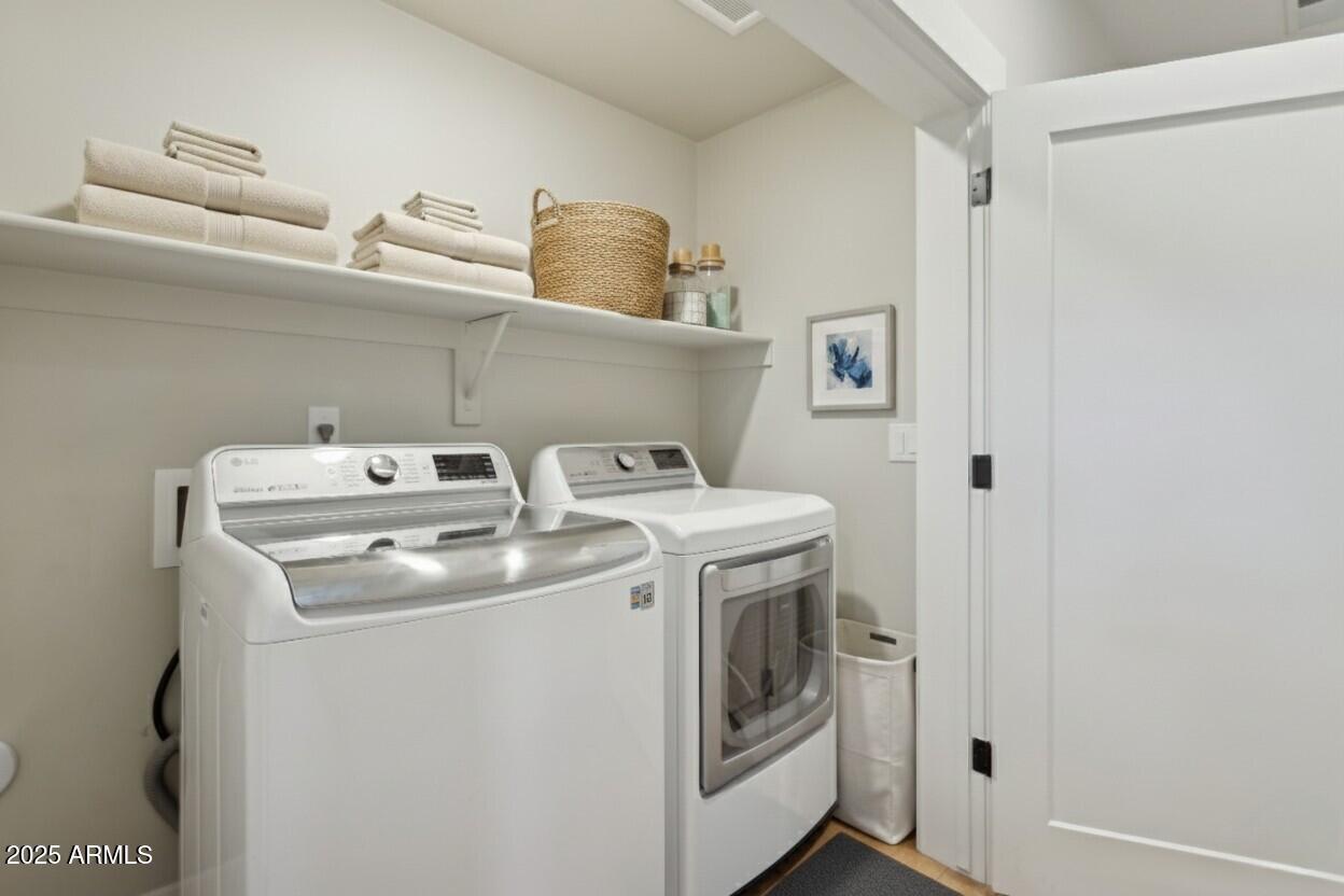 1400 East Bethany Home Road, Unit 22 Phoenix, AZ 85014 - Photo 29 of 46 a utility room with dryer and washer