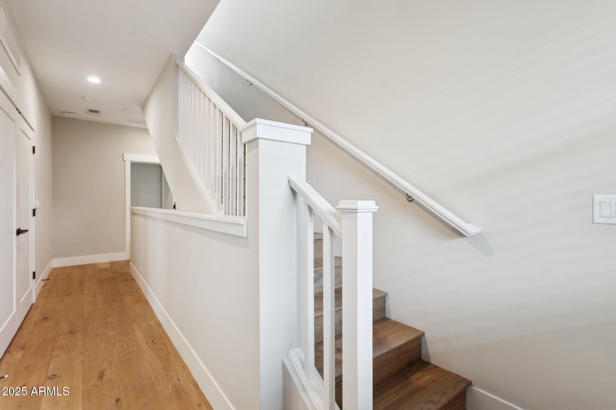 1400 East Bethany Home Road, Unit 22 Phoenix, AZ 85014 - Photo 30 of 46 a view of entryway with stairs and wooden floor