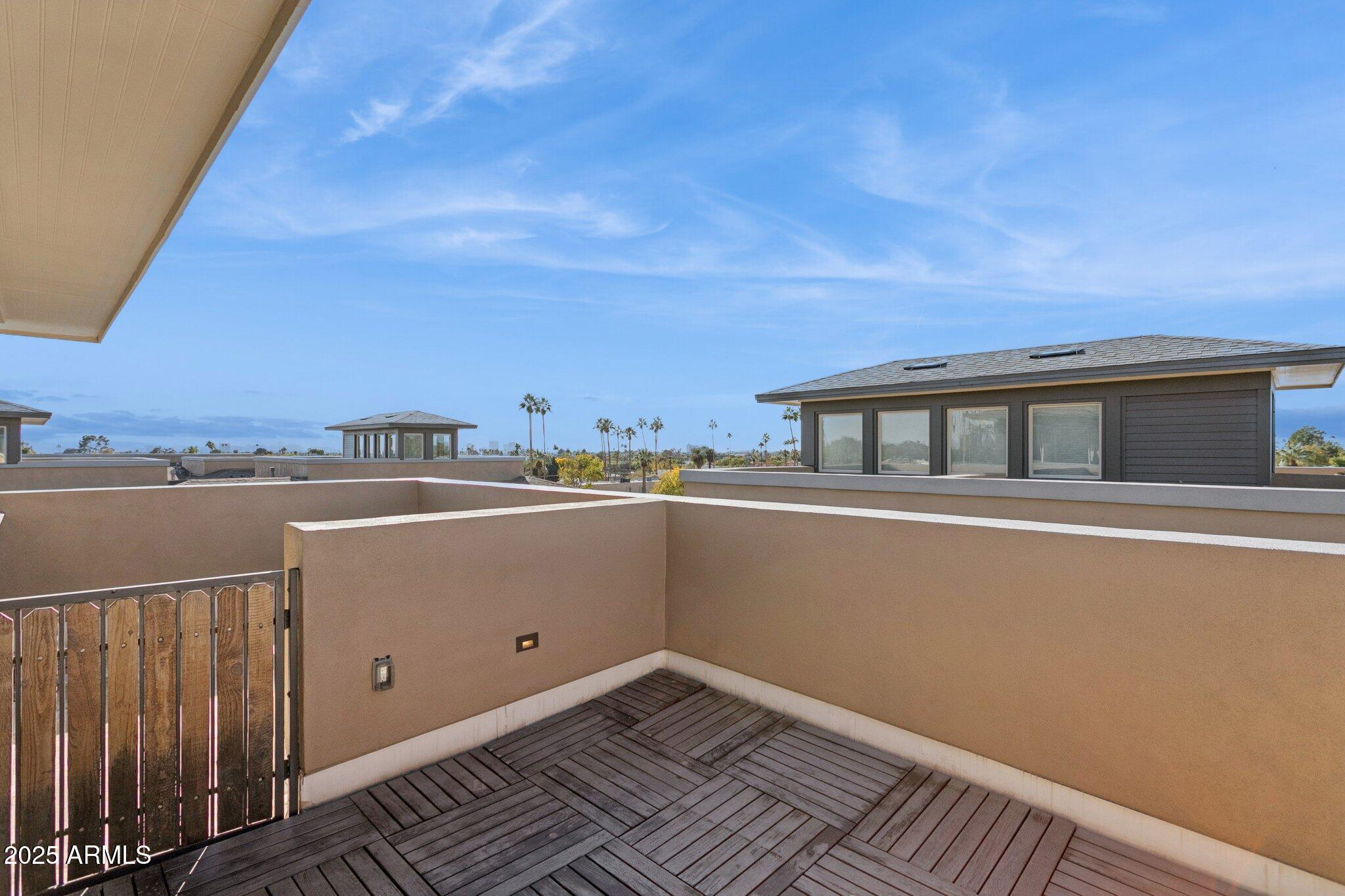 1400 East Bethany Home Road, Unit 22 Phoenix, AZ 85014 - Photo 32 of 46 a view of a balcony with wooden floor