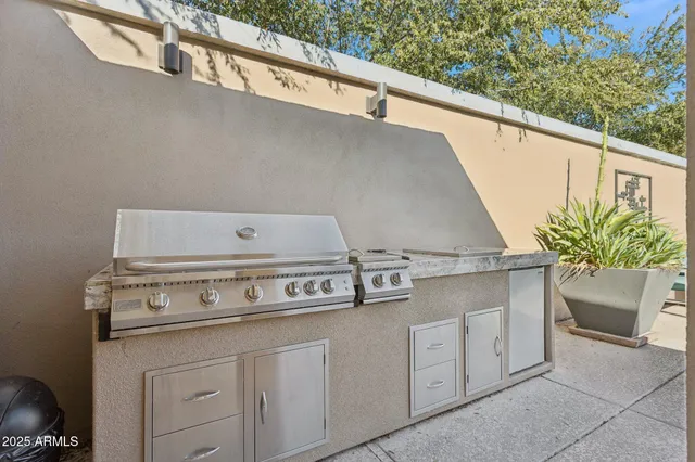 a bathroom with a shower a sink and a mirror