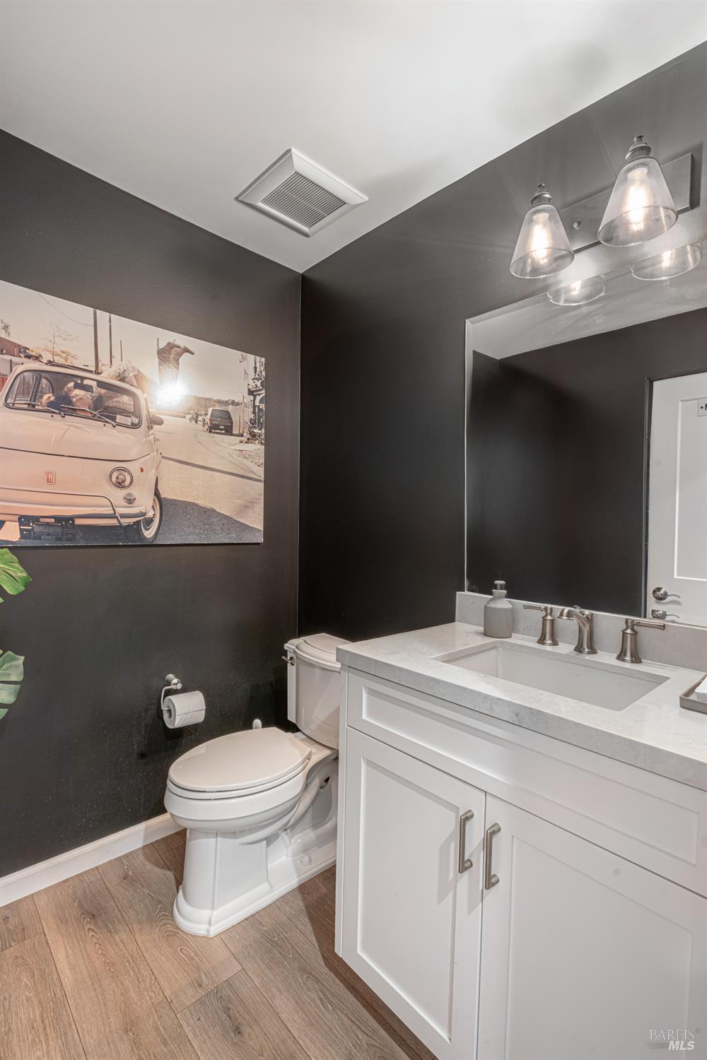 4414 Bally Bunion Lane Santa Rosa, CA 95403 - Photo 5 of 18 a bathroom with a sink toilet and mirror