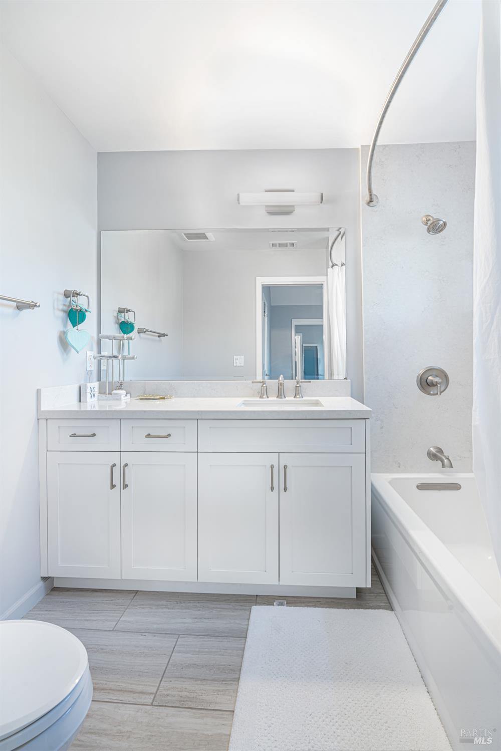 4414 Bally Bunion Lane Santa Rosa, CA 95403 - Photo 8 of 18 a bathroom with a sink a toilet and shower
